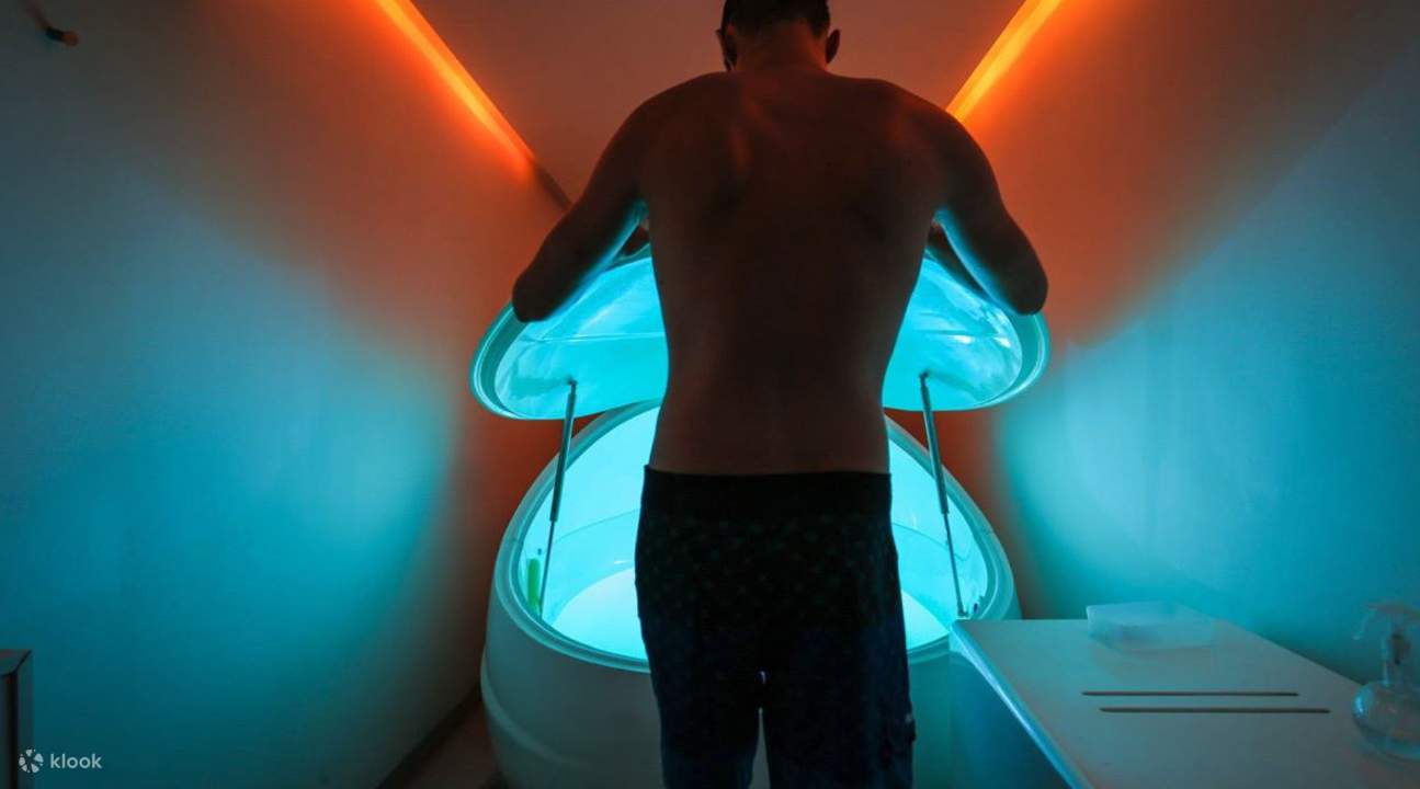 man standing outside of pod